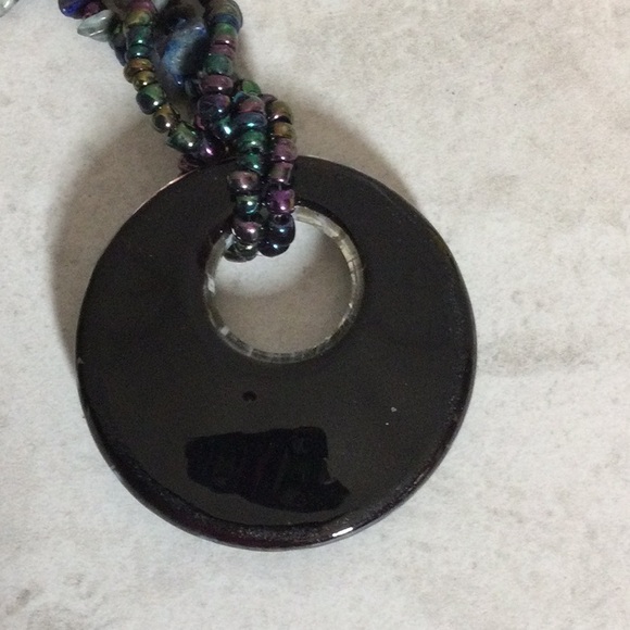 Iridescent bead necklace with Puka shells and  starburst pendant - Picture 4 of 7